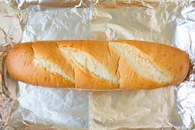 Wrap the baguette in the foil, place on a baking sheet and bake for 15 minutes. Cheesy Garlic Bread Easy Homemade Cooking Classy