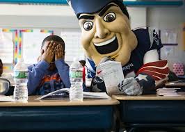 Pat the Patriot and cheerleaders spread the love at Brockton school
