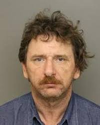 What was NC ex con doing with 40 weapons and 2,000 rounds of ammo?