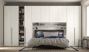 Some modular shelves are studded on the pink wall. Modular Bedroom Furniture Imab Group