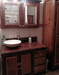 A double sink bathroom vanity with makeup table gives the space a further function. Red Cedar Vanity With Barn Wood