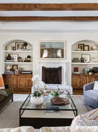 Built in china cabinet is stained blue with yellow crown molding accent. How To Make Your Built In Shelves Work Harder Architectural Digest