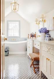 Black And White Farmhouse Bathroom Tile Gorgeous Cottage Bathroom Boasts A Seagrass X Stool Placed On Black And White Lattice Floor Til Bathroom Cabinets Designs Cottage Bathroom Bathroom Inspiration