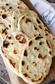 Naan Is A Traditional Indian Flat Bread That Is Pillowy Soft And Delicious This Easy Naan Bread Reci Recipe Using Plain Yogurt Plain Yogurt Recipes Naan Bread