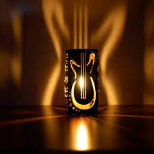 White oak fireplace is accented with a white penny tile mantel displaying a black candle holder, a silver oval ring vase and gray and gold. Pin On Crafts