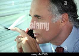 Private detective, undercover cop, investigator, spy or paparazzi with  camera taking photos. Agent or police spying, investigating or following  people Stock Photo