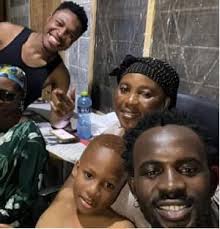 A rare photo of Black Sherif and his family