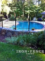 Wrought Iron Fence Installed On A Stone Wall Around A Pool And Curved With Angle Brackets 3ft Tall Classic In T Iron Fence Fence Landscaping Fence Around Pool