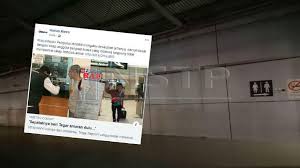 Papan tanda menunjukkan bahawa kawasan taman perumahan dan sekitarnya berisiko ditenggelami air. Dia Merokok Di Kawasan Papan Tanda Larangan