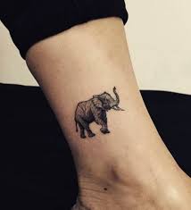 25 Good Luck Tattoo Symbols With Meaning Behind Them Elephant Tattoo Small Tiny Elephant Tattoo Small Tattoos For Guys