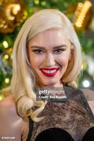 35 Gwen Stefani Lights The Empire State Building To Promote The Holiday  Light Show Photos & High Res Pictures