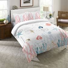 Get the same colour combination for the pillows on the chair to make a good match. Coral Cove Comforter Laural Home