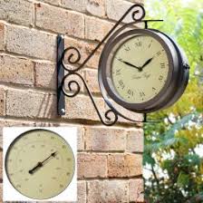 With a sleek antique bronze finish, this hanging clock thermometer is a wonderful addition to any area of the home, indoors or outside; Garden Clocks With Thermometers 15 From 21 99