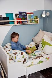 Toddler kid crawling on bed with white bedding and pointing with finger at home. Sundvik Ext Bed Frame With Slatted Bed Base White Ikea