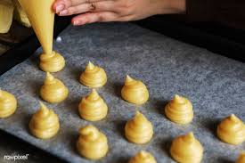 Download Premium Image Of Piped Choux Pastry On A Tray 485314 Choux Pastry Pastry Raisin Recipes