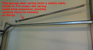 File Garage Door Spring Needs A Safety Cable Through It Jpg Garage Doors Garage Door Springs Garage Door Replacement