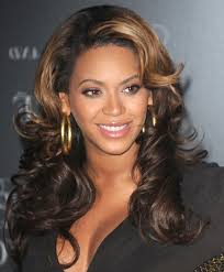 To create this style, add your favorite styling product to your hair and use a small barrel curling iron to create waves throughout. Breath Taking Golden Highlights Waves Long Wavy Hairstyles Beyonce Hairstyles Hairstyles Weekly