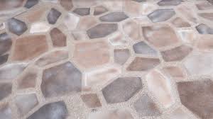 You can buy two or three different colors and create the stone pattern that you want. Fake An Expensive Looking Patio With Spray Paint Simplemost