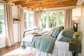 White walls, white furniture and a window make the small but stylish space feel brighter and larger. 30 Hgtv Bedroom Makeovers Hgtv Small Master Bedroom Home Bedroom Bedroom Design