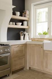 The amount of natural light in this room prevents the dark wood from leaving the kitchen feeling like a cave. Light Wood Kitchen Cabinets Transitional Kitchen