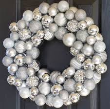 Blue and silver christmas wreath with dollar tree sign. 27 Festive Diy Christmas Wreaths