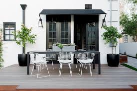 Brown metal legs with tile top and umbrella holder. Long Black Outdoor Dining Table Design Ideas