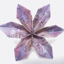Either add your flower to a vase or tie it to an origami box as a package decoration. Instructions For Origami Money Flowers