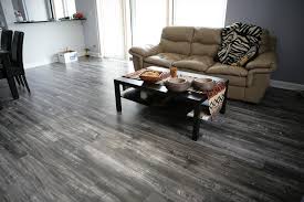 A 1940's bungalow was renovated and transformed for a small family. Living Room Dark Grey Laminate Flooring Laminate Flooring