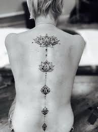 55 Pretty Lotus Tattoo Designs With Images Spine Tattoos For Women Flower Spine Tattoos Tattoos