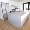 Grey kitchen cupboards white benchtop lathe with white body. 3