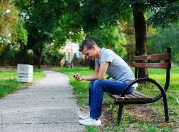 We did not find results for: Young Man Sitting On The Park Bench And Checking Phone By Mosuno Park Mobile Phone