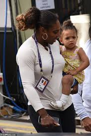 Williams can be seen in the back of the photo looking on proudly. Serena Williams Carries Daughter After Wimbledon Tennis Practice Venus And Serena Williams Serena Williams Serena Williams Photos