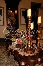 The tuscan coffee table is a great table for the living room. Wood Candlesticks Tuscan Decorating Table Decor Living Room Decorating Coffee Tables