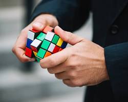 Image of person solving a Rubik's Cube
