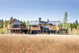The residence overlooks a mountain lake with expansive mountain views beyond. Continental Divide Colorado Modern Mountain Home Exterior Minimalistisch Hauser Denver Von Vetter Architects Houzz