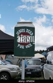 Hand Painted Large Green Beer Can Sign Stating Jesus Died For Our Tins At The Meredith Music Festival In Meredith Australia Blue Sky Puffy Clouds Stock Photo Alamy