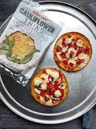 I always keep the trader joe's ingredients in my pantry, so that i can pull one together in minutes on nights that require pizza. We Tried Trader Joe S Cauliflower Thins Trader Joes Recipes Healthy Trader Joes Meal Planning Food