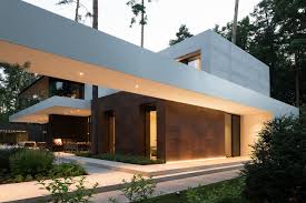 The natural materials of the forest house continue inside of the home too, where rich wooden walls make up the majority of the decor. Modern Forest House Designed To Become A Serene Sanctuary Architecture Beast