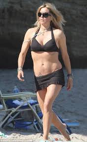 Bruno leoni was born in 1913. Tea Leoni Flashes Anchor Tattoo As She And David Duchovny Celebrate July 4 With A Family Day On The Beach Tea Leoni Classy Women Beauty Women