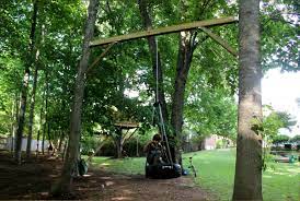 Tire Swing Between Two Trees Great Idea If You Don T Have A Long Sturdy Branch To Hang It From Backyard Swings Backyard Fort Outdoor