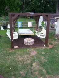 The ring was cut from a caisson piling. Our Oasis Swings Fire Pit And Bed We Did Rubber Mulch Fire Pit Backyard Backyard Fire Outdoor Fire Pit