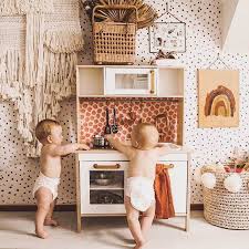 Make a little room for yourself with comfy glider chairs and ottomans to rest or take quick naps. Black Spot Wallpaper For Baby Nursery Interior By Livettes