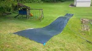 Long slip and slide tarp. Diy Sprinkler And Slip N Slide Setups For Summer