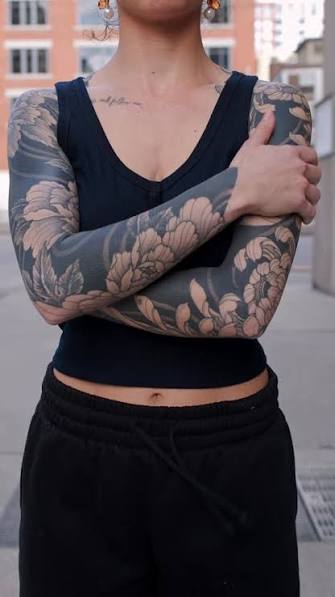 Full blackwork floral cover up sleeve by @severino.tattoos 🏴fully healed and settled, using bold saturation to frame soft botanical negative space🔥Captured in natural light to highlight contrast, skin ...