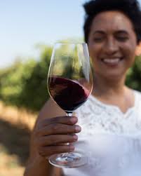 Carmen in her element—among the vines where passion meets precision. It's  here, between the vine and the wine, that the magic truly happens. A force  of nature, every bottle of Carmen Stevens