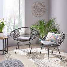 Aleah Indoor Woven Faux Rattan Chairs With Cushions Set Of 2 Tropical Armchairs And Accent Chairs Armchairs And Accent Chairs Rattan Chair Interior Spaces