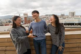 Two friends laughing loud at home. Group Of Chinese Friends Laughing Together On Balcony Young Adult Friendships Stock Photo 214313150