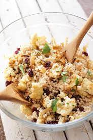 The flavors in this couscous salad are a riff on the flavors of afghani brown rice, only this takes but a few minutes to throw together and is a lovely accompaniment to my lamb chops. Toffee Crunch Banana Cake Recipe Roasted Cauliflower Couscous Caramelized Onions
