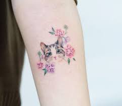 If you were looking for more minimalist cat tattoos, then this one probably took your interest. Cat And Flowers Tattoo By Zihee Tattoo Post 29720
