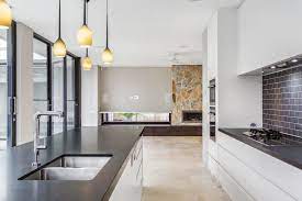Galley kitchen with cream cabinets with brown glaze and tan tile. 36 Inspiring Kitchens With White Cabinets And Dark Granite Pictures Home Stratosphere